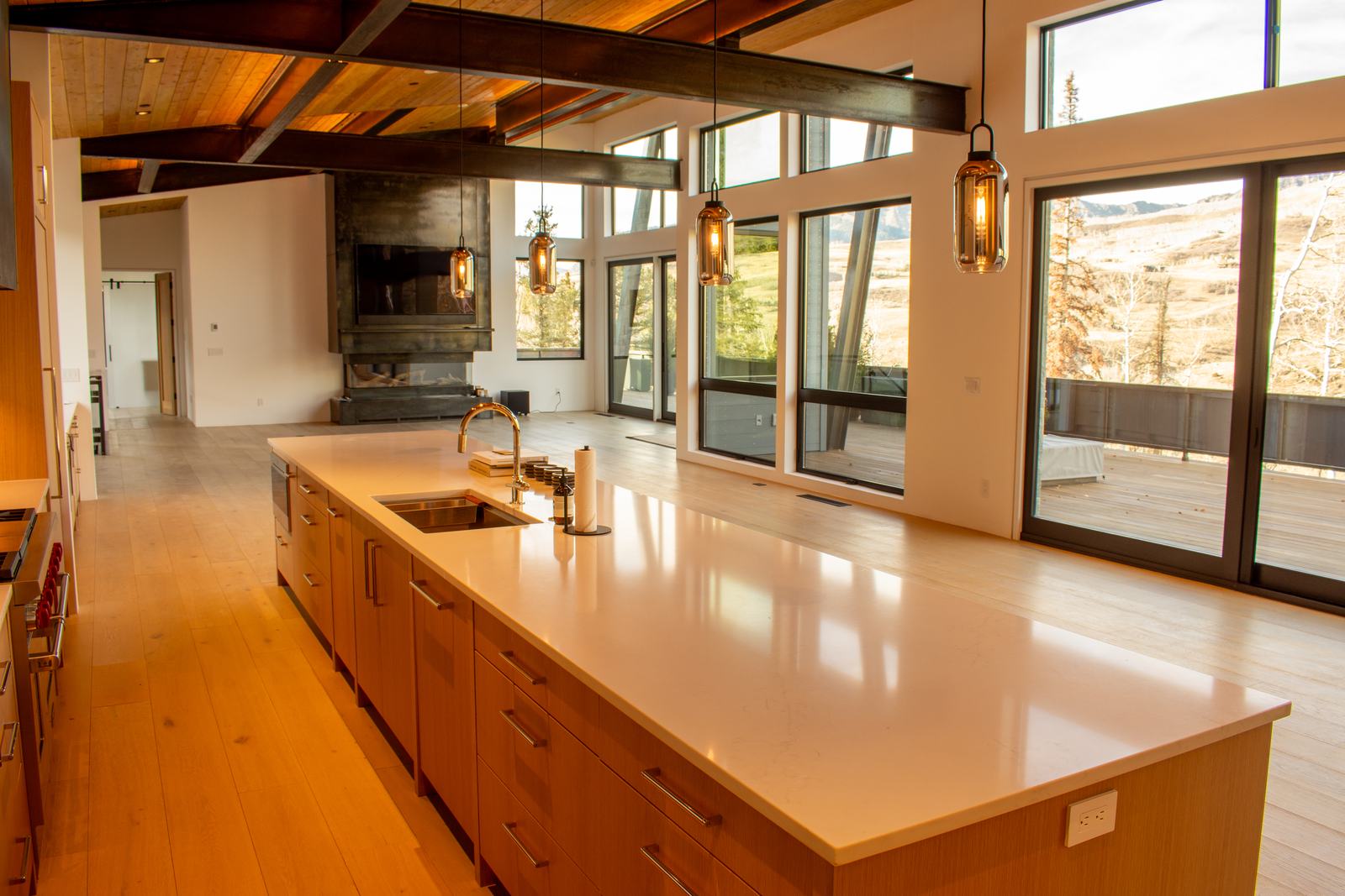 Kitchen island and window wall at 110 Lawson Overlook, built by UltraBuilders in Mountain Village, Colorado