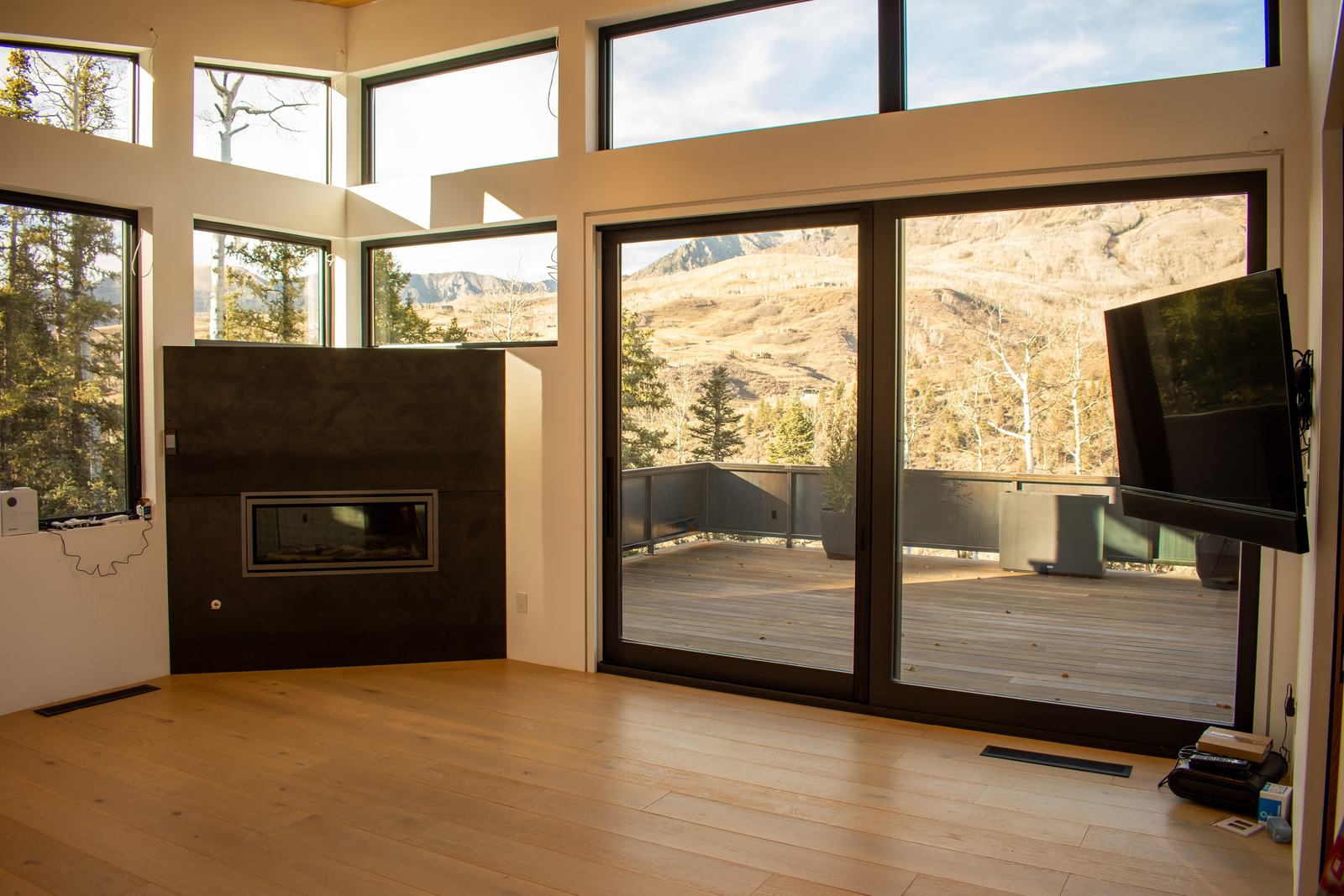 Living room and fireplace at 110 Lawson Overlook, built by UltraBuilders in Mountain Village, Colorado