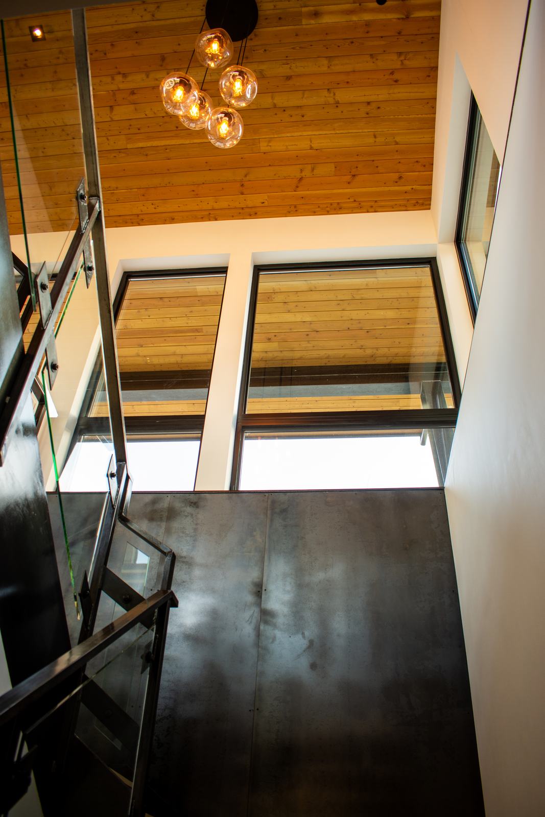 Steel and glass stair at 110 Lawson Overlook, built by UltraBuilders in Mountain Village, Colorado