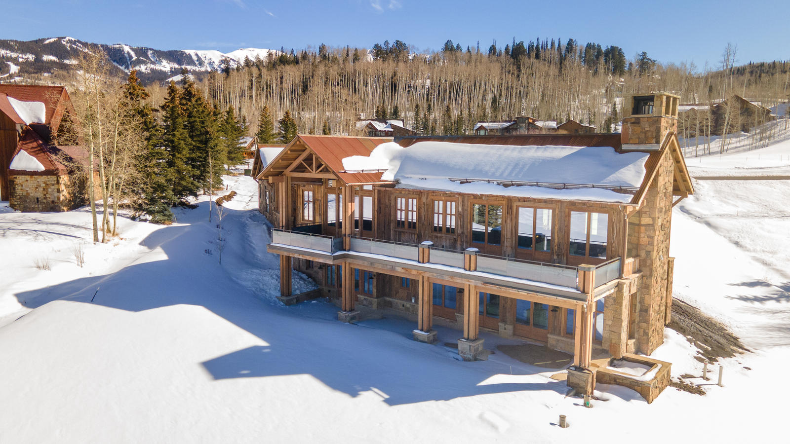 Aerial view in winter at 125 Russell Drive, built by UltraBuilders in Mountain Village, Colorado
